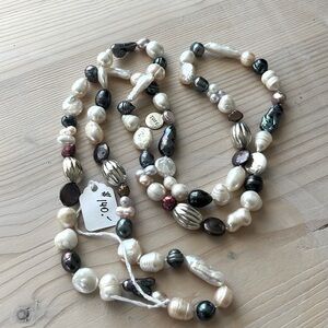 Authentic river pearls with a mix of sizes and colours and silver balls